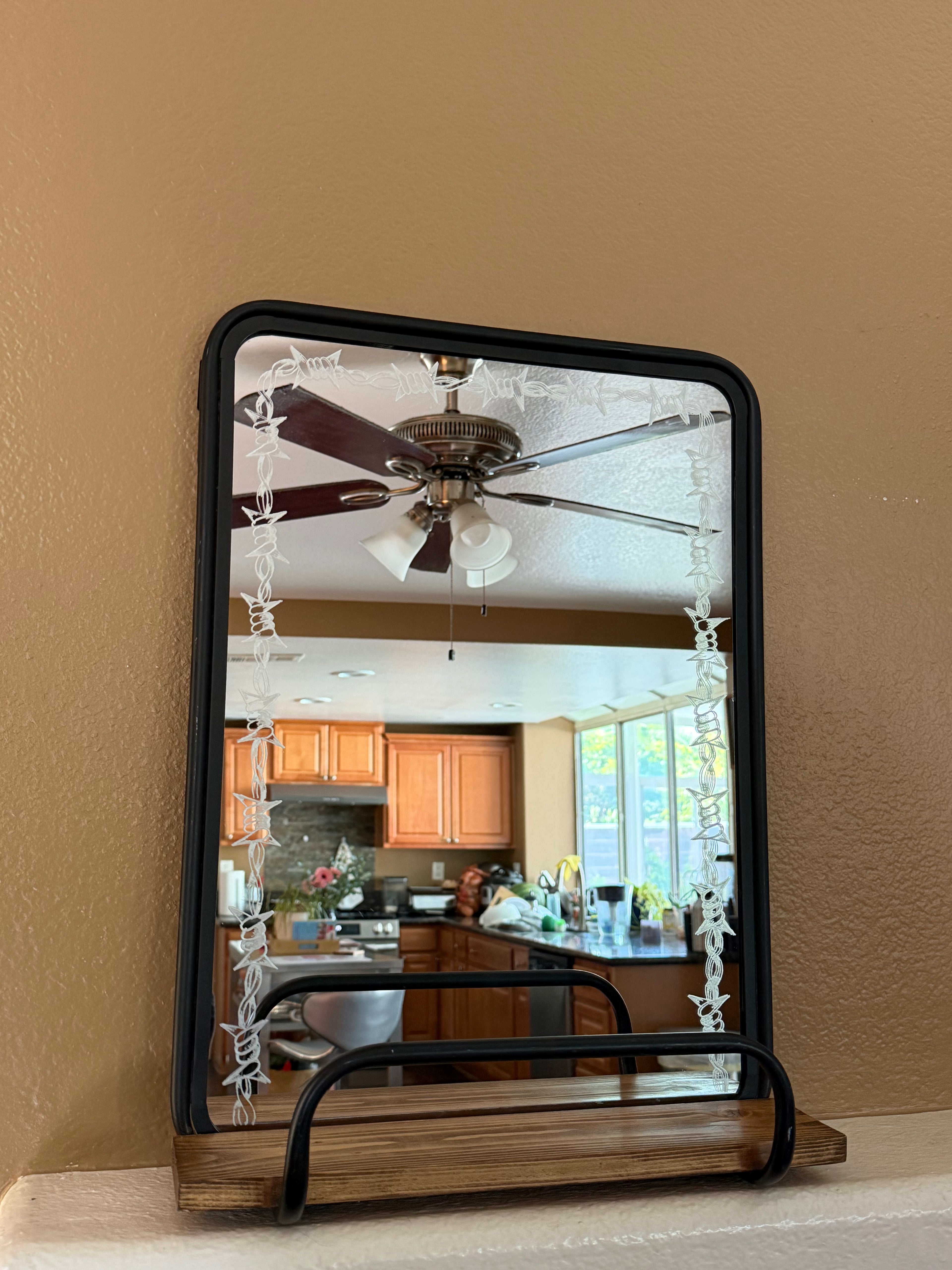 Barbed wire shelf mirror